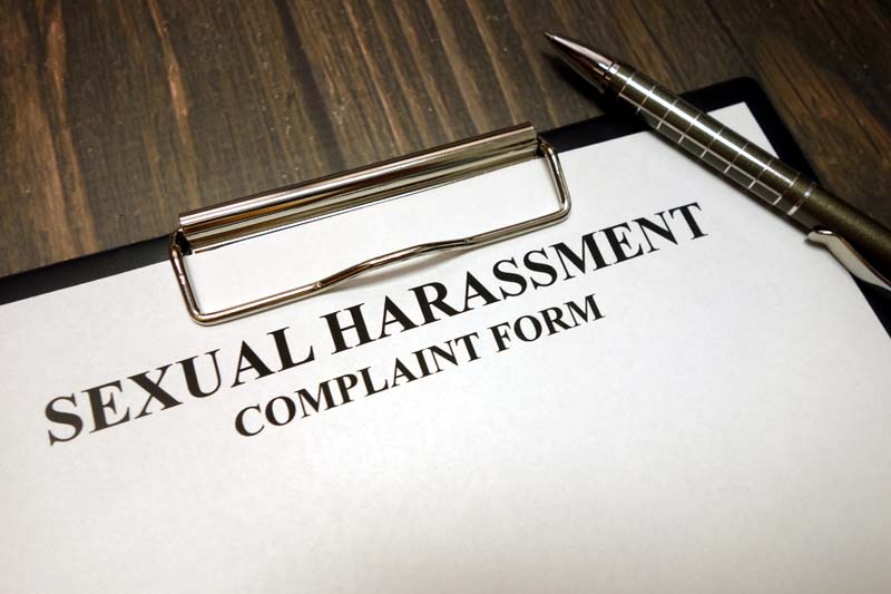 Sexual harassment complain form on clip board
