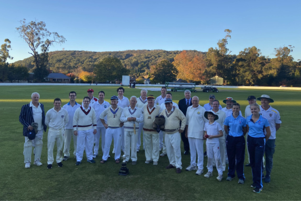 group shot of players and umpires at the end of the day