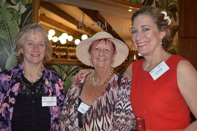 Three women attending the event
